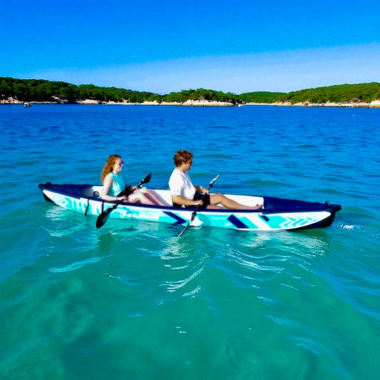 Two people paddling the inflatable 1-2 person drop stitch kayak package canoe ikayak on blue water.