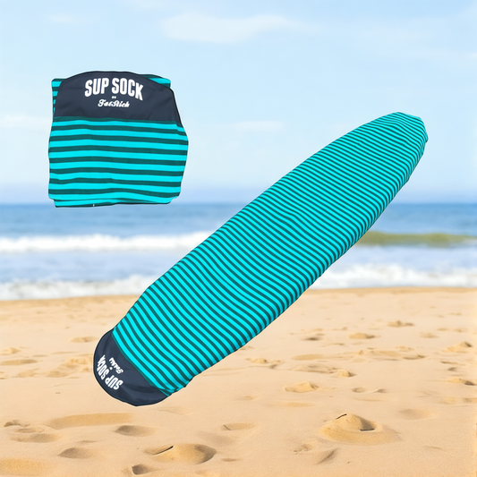 Aqua and black striped FatStick 10'6 SUP SOCK paddle board bag unfolded on beach next to folded bag