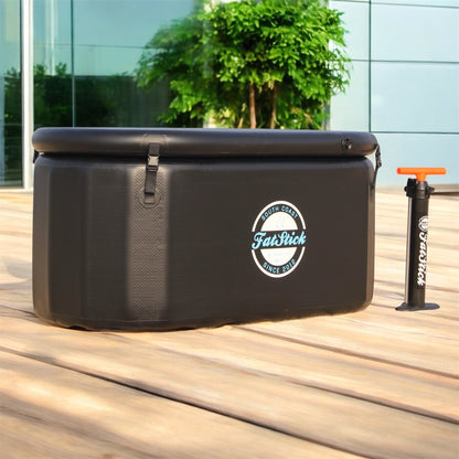 FatStick pro cold water therapy plunge tub with pump, set outdoors on deck beside building.