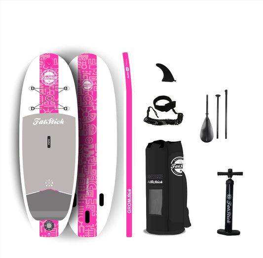 Pink and white Fatstick Kids 7'6 GromStick inflatable stand up paddle board package with accessories.