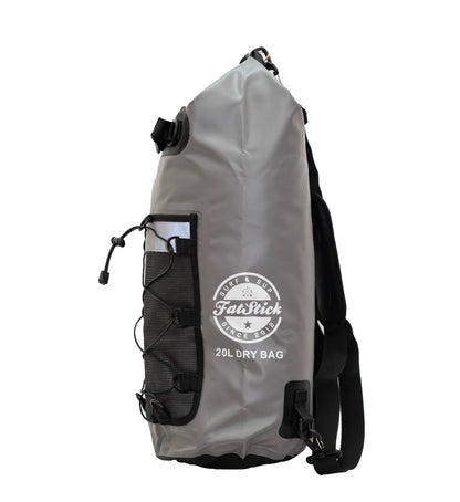 Grey 20Ltr FatStick Dry Bag & Backpack side view, showing white logo, mesh pocket with bungee cord, and black strap.
