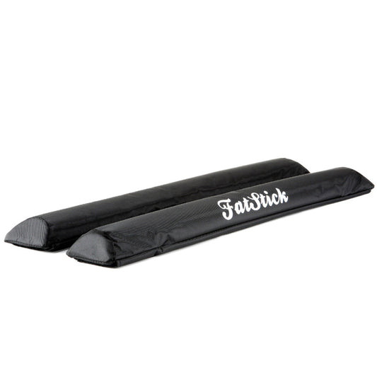 Angled view displaying two black FatStick Long Aero Roof Rack Bar Pads 71cm with white logo
