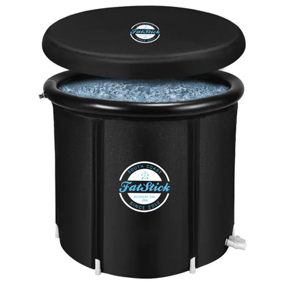 Round FatStick Recovery Ice Bath with lid slightly ajar, filled with ice and water, on a white background.