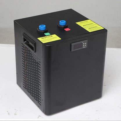 Angled view of the FatStick Boards home chiller unit with blue nozzles and warning labels