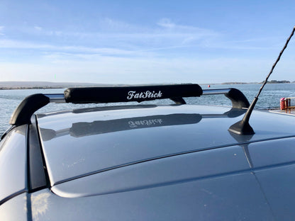 FatStick Long Aero Roof Rack Bar Pad 71cm on a car roof rack overlooking the ocean