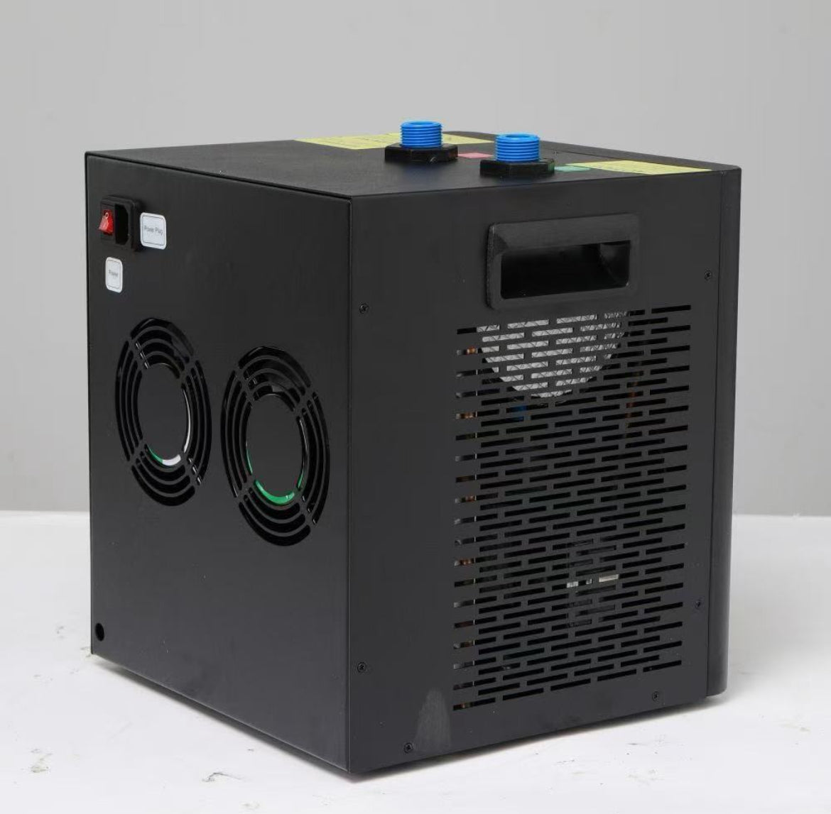 Angled view of the FatStick Boards home chiller unit showing side vents and a power switch