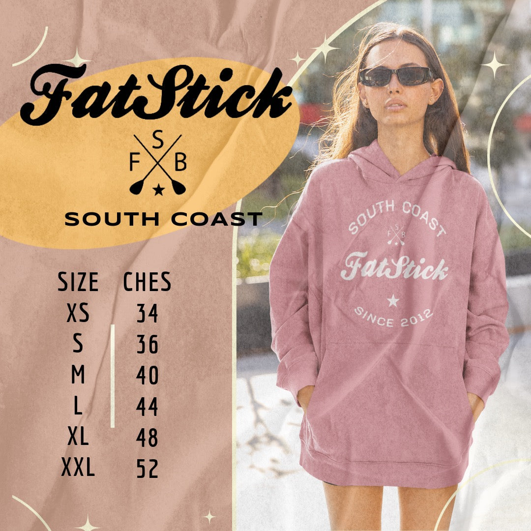 FatStick South Coast Lifestyle Hoodie size chart in white text with pink accents, next to a woman wearing the hoodie and sunglasses