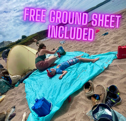 Blue ground sheet on a sandy beach with a woman and child, text 'FREE GROUND SHEET INCLUDED'.