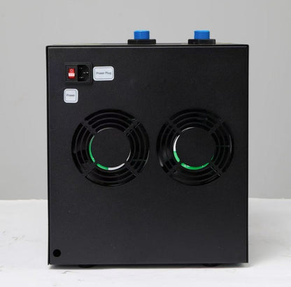 Rear view of the black home chiller unit for ice baths with two green fans and a red power switch