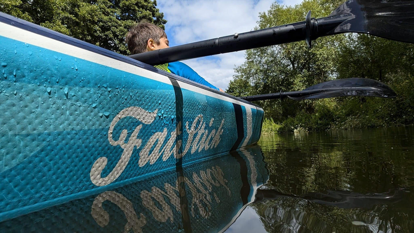 Close-up of a child in the inflatable 1-2 person drop stitch kayak package canoe ikayak on the water.