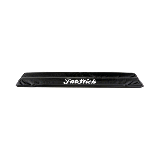 Top down elevated view of black FatStick Long Aero Roof Rack Bar Pads 71cm with white logo