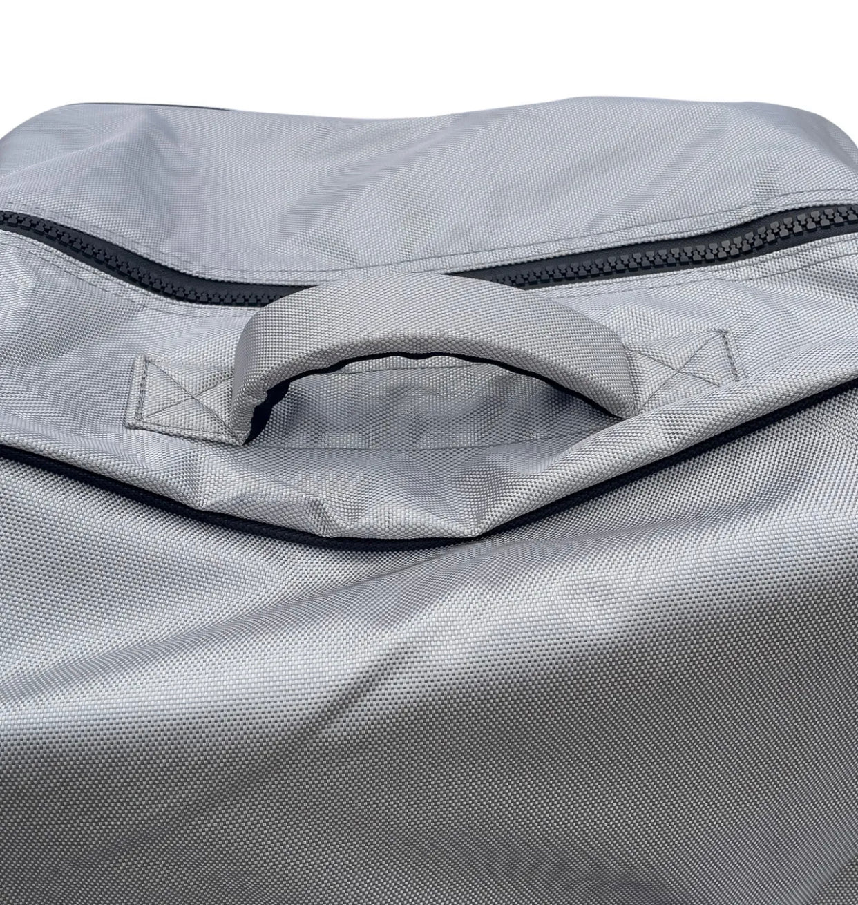 Close up of the sturdy top handle of the gray FatStick Wheeled Storage Bag Backpack.