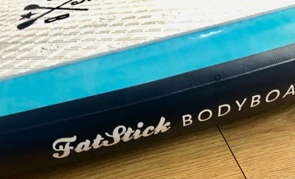 Close-up of the side of the Inflatable 43 Fatstick Body Board with the FatStick Bodyboard logo visible.