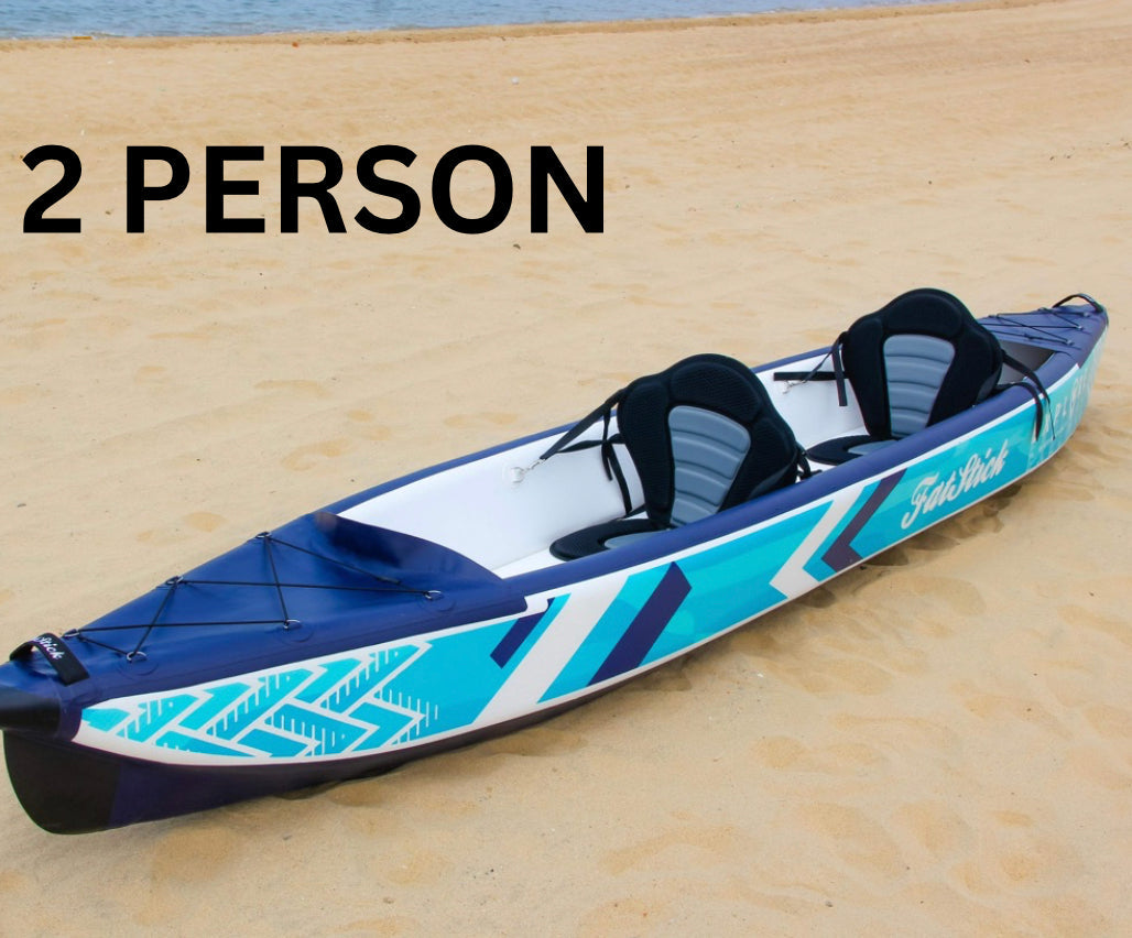 Inflatable 1-2 person drop stitch kayak package canoe ikayak on a sandy beach, set up for two people.